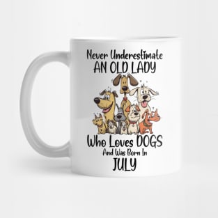 Never Underestimate An Old Lady Who Loves Dogs And Was Born In July Mug